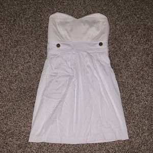 White strapless sweetheart dress with brown button detail